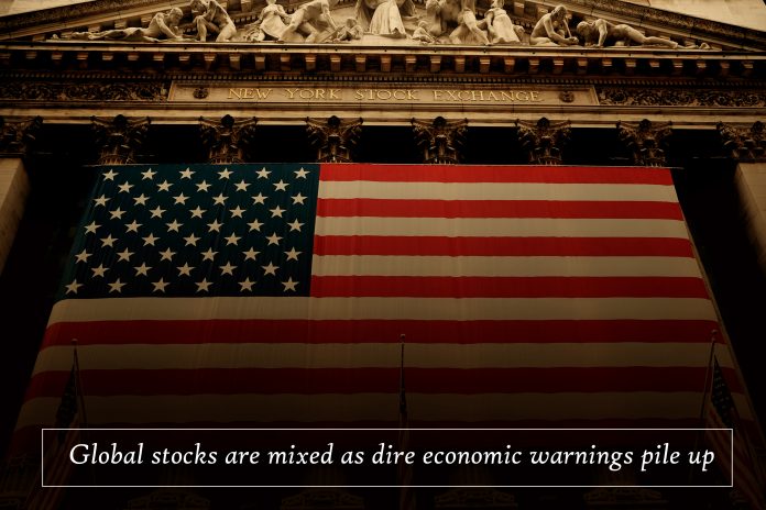 Worldwide stocks mixed as dreadful economic warnings crash