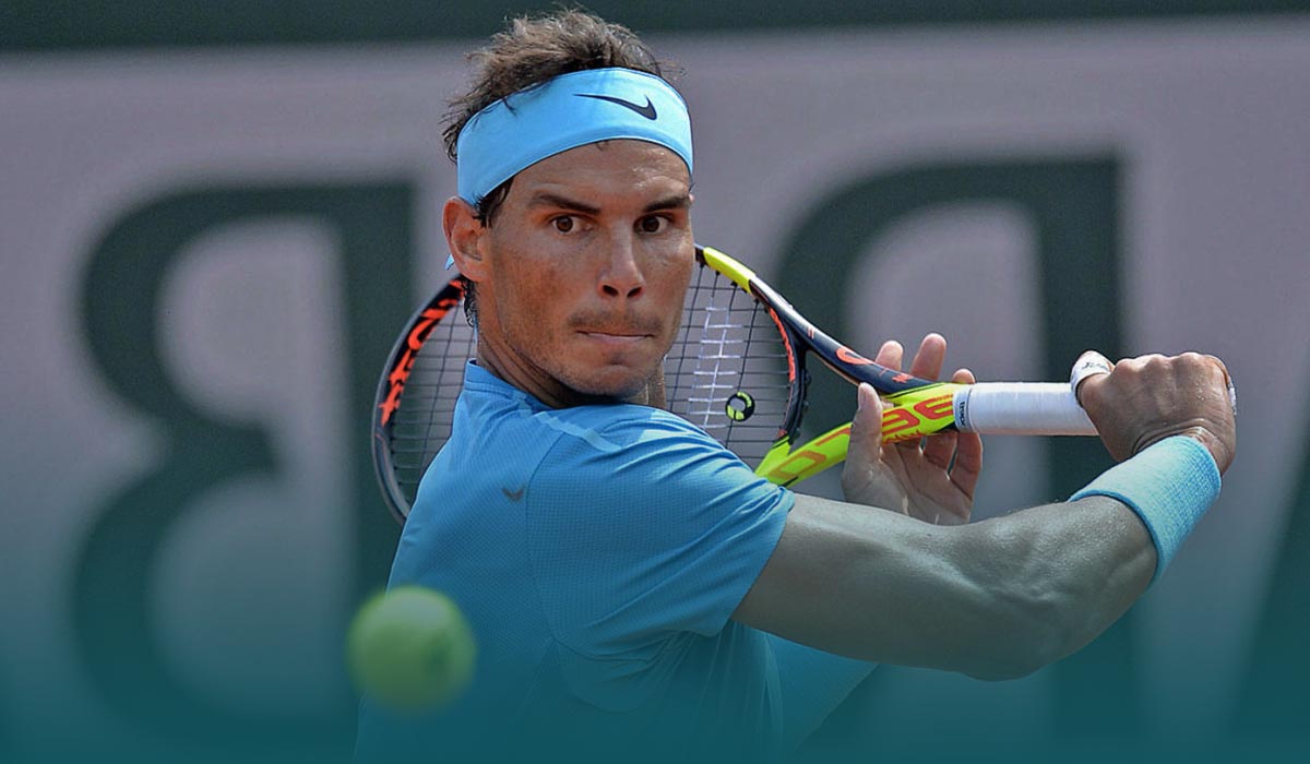 Nadal combats cold weather to gain victory at French Open